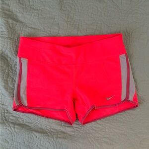 Nike Dri-fit tight running shorts, size medium, bright pink.